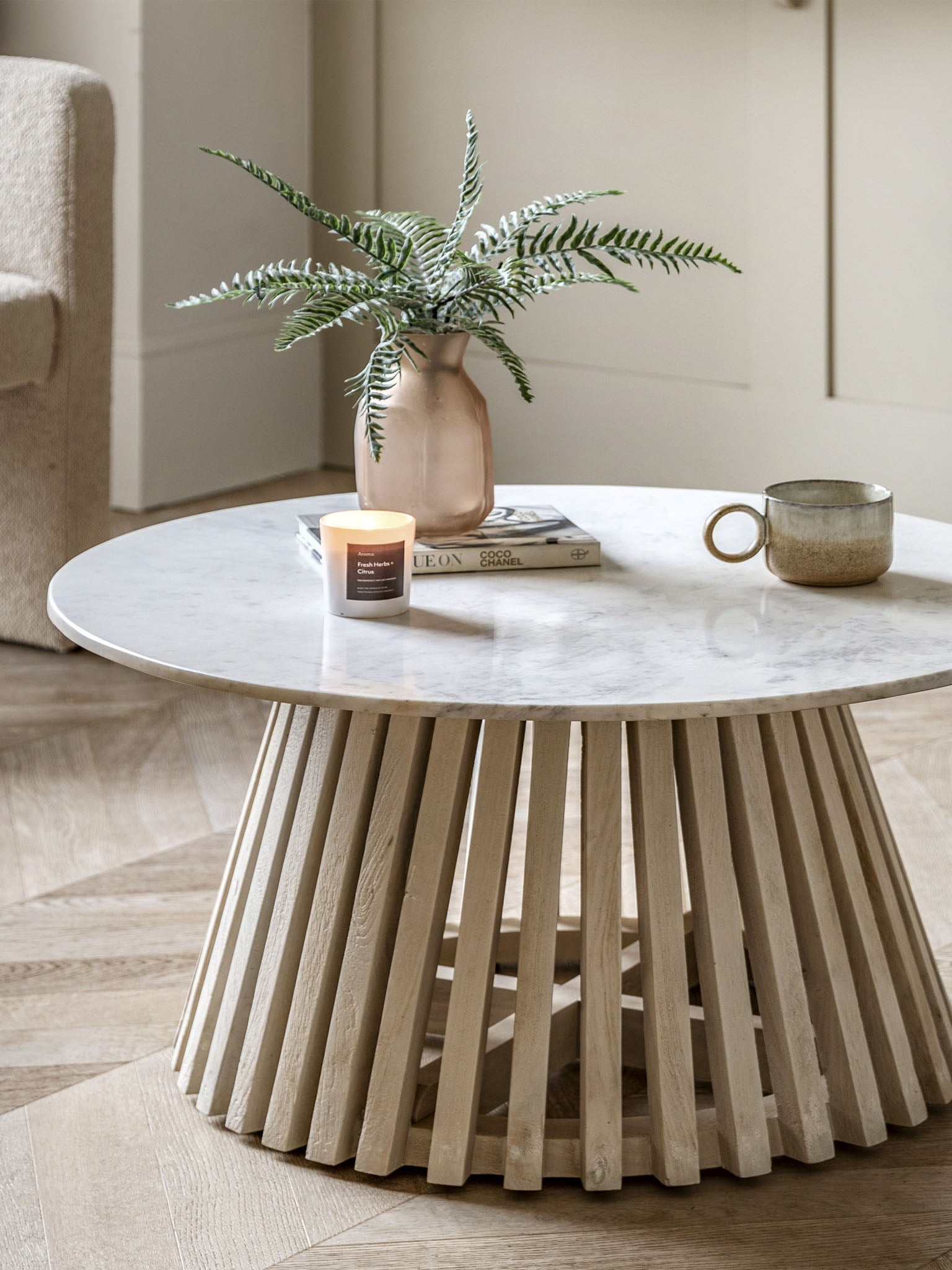 Round coffee table with marble top and wooden base