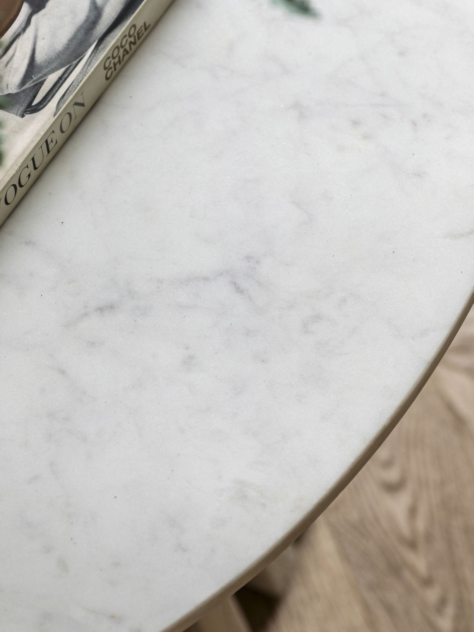 Round coffee table with marble top and wooden base