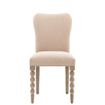 Upholstered dining chair with bobble leg detail