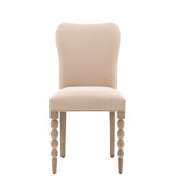 Upholstered dining chair with bobble leg detail