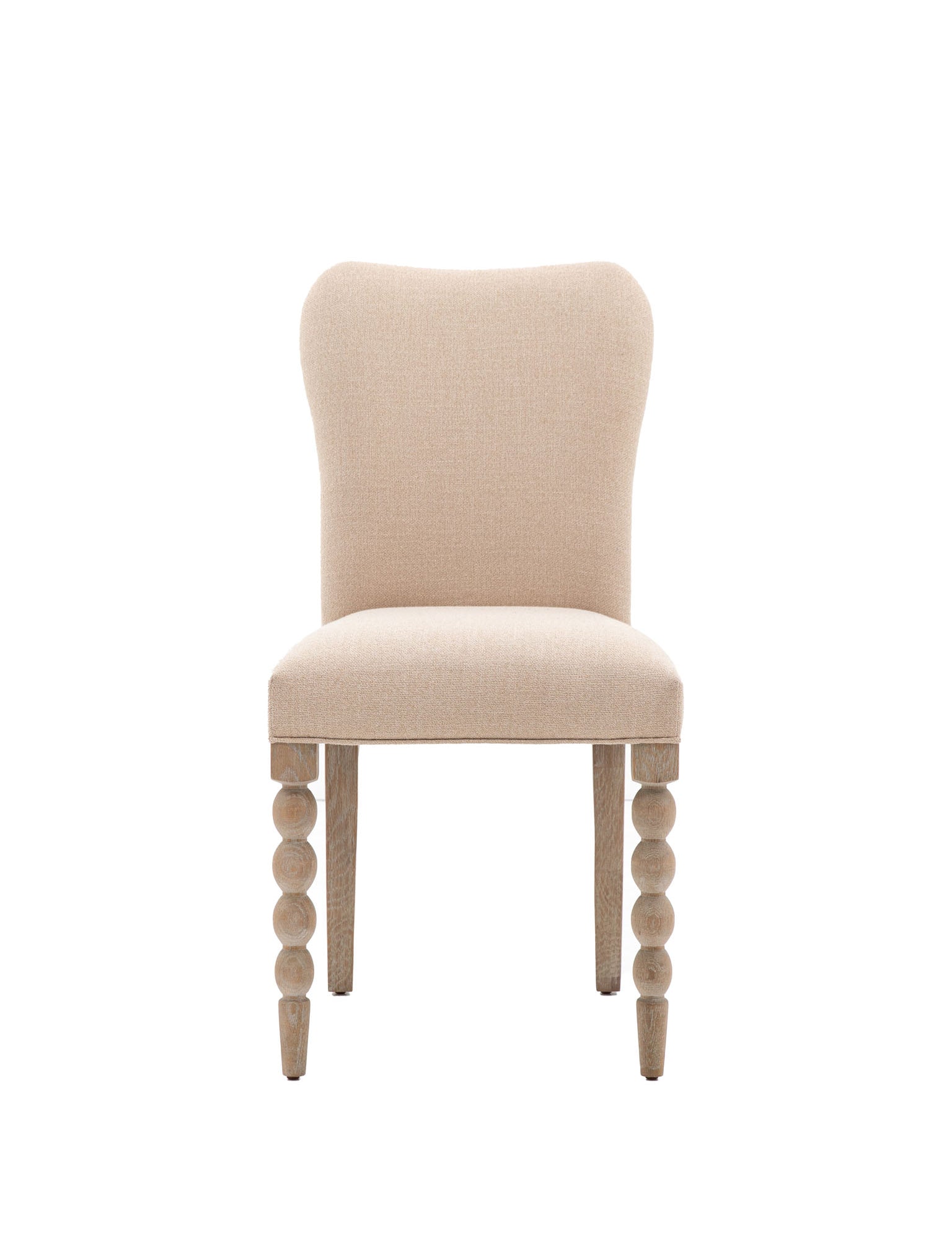 Upholstered dining chair with bobble leg detail