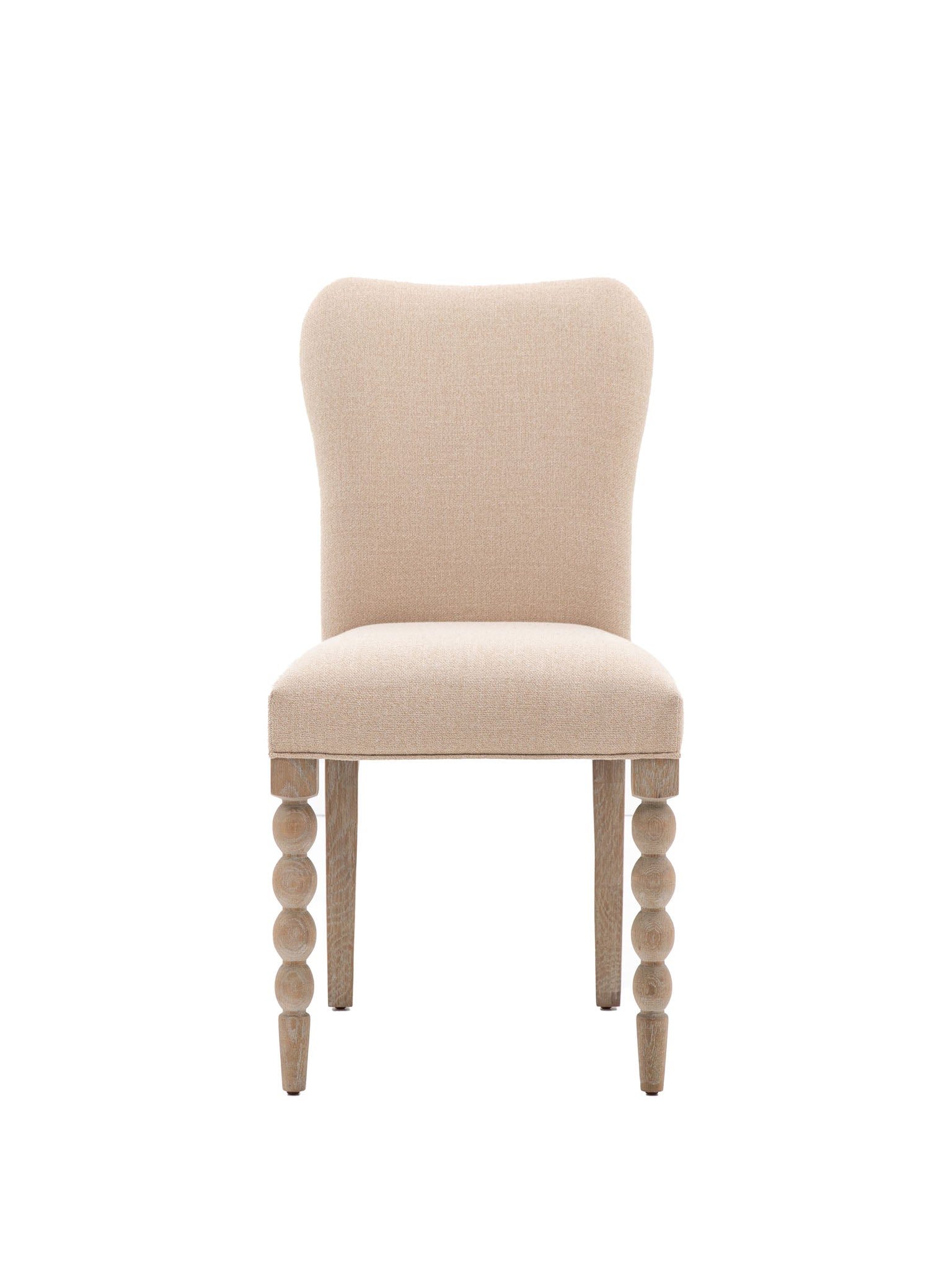 Upholstered dining chair with bobble leg detail