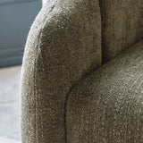 Moss green tub chair with curved sides