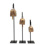 cow bells on a black metal stand set of 3
