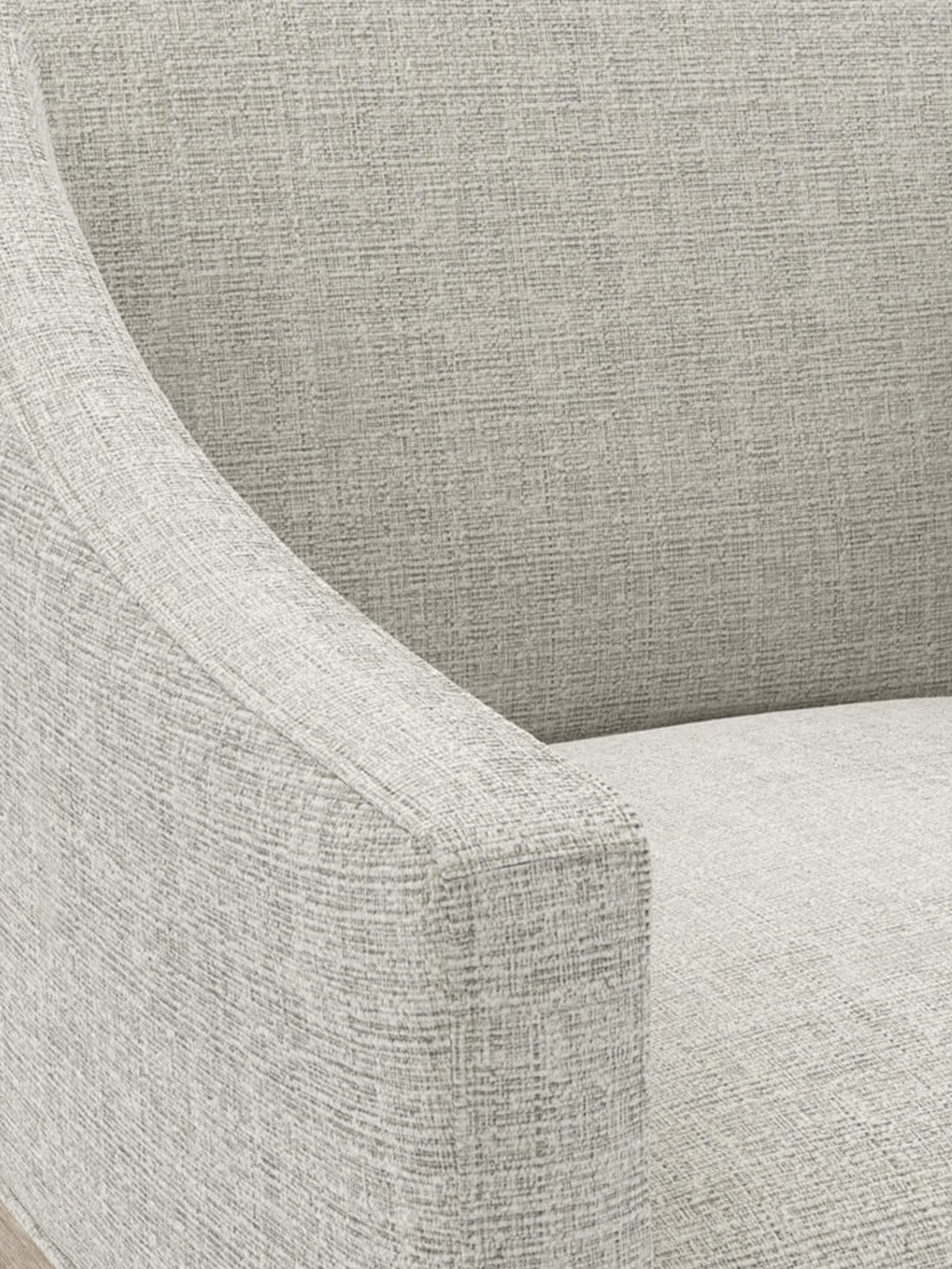 Close-up of a textured gray chair with a focus on the fabric pattern.