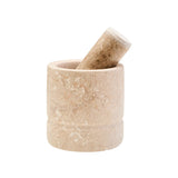 Beige stone mortar and pestle on a white background