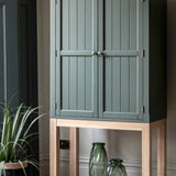 Farmhouse style oak painted cabinet in moss