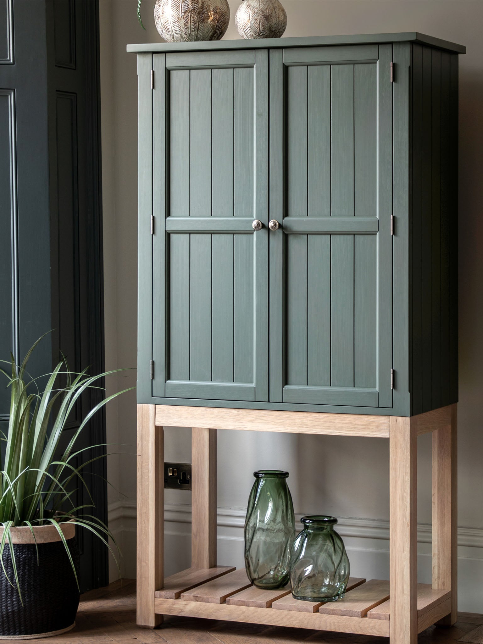 Farmhouse style oak painted cabinet in moss
