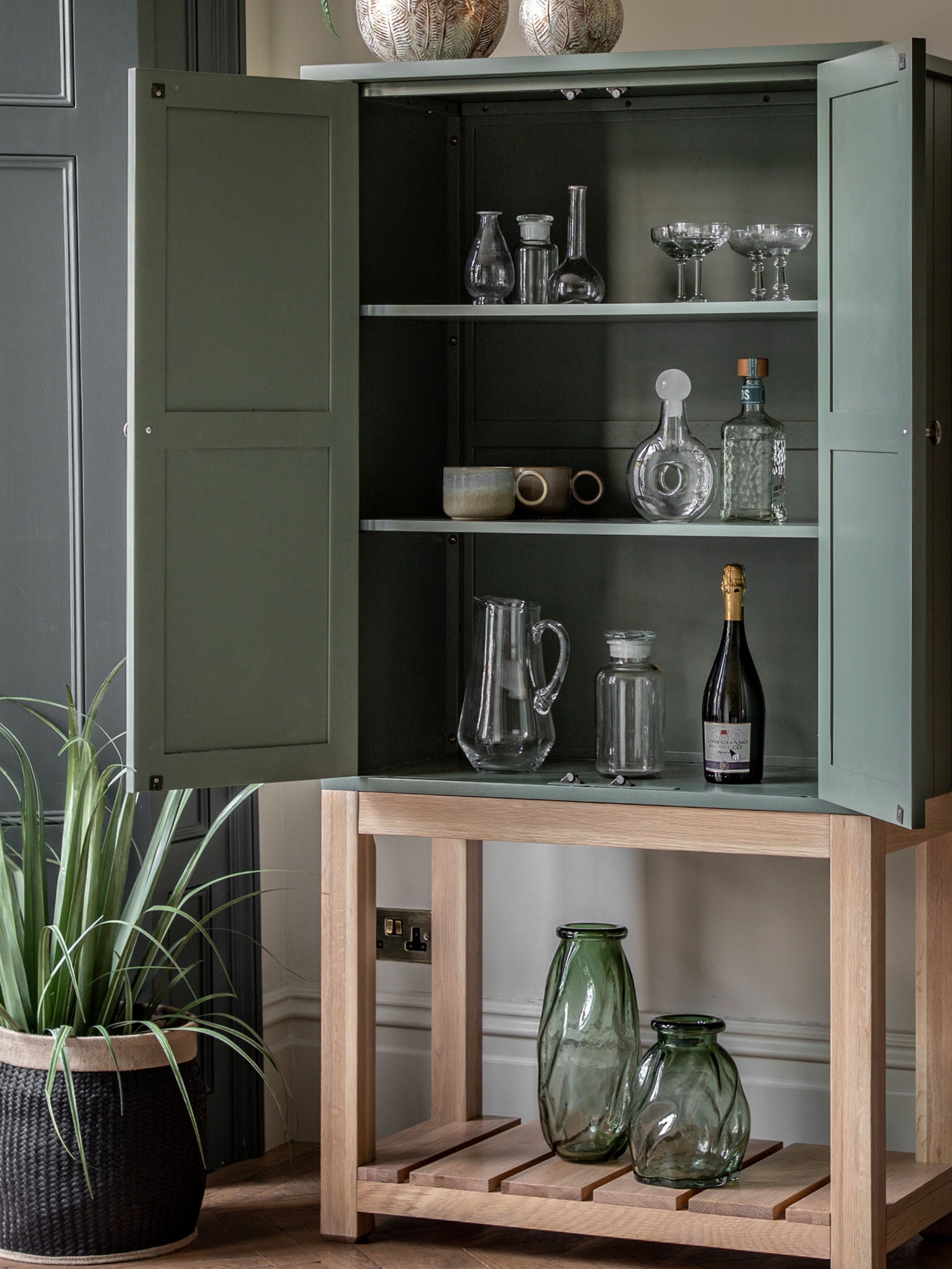 Farmhouse style oak painted cabinet in moss