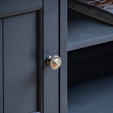 farmhouse style oak top media unit painted in dark navy