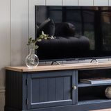 farmhouse style oak top media unit painted in dark navy