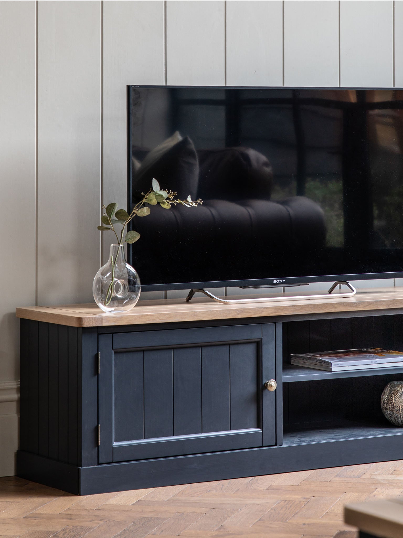 farmhouse style oak top media unit painted in dark navy