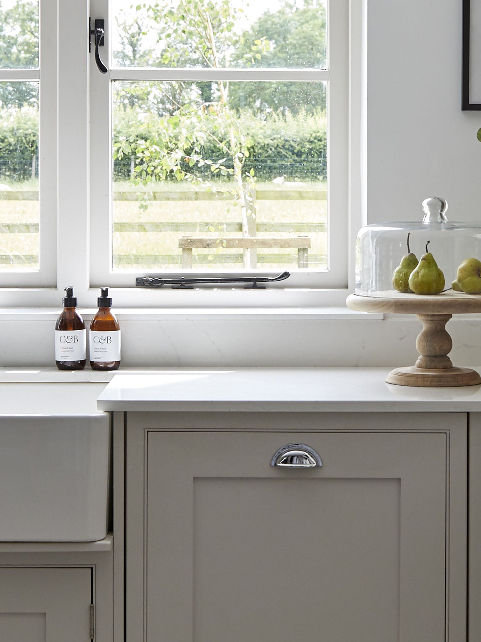 hand and body lotion next to belfast kitchen sink