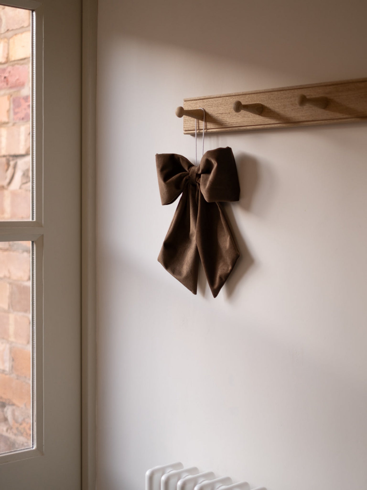 Brown velvet hanging bow 