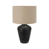 Antique black textured wooden table lamp.