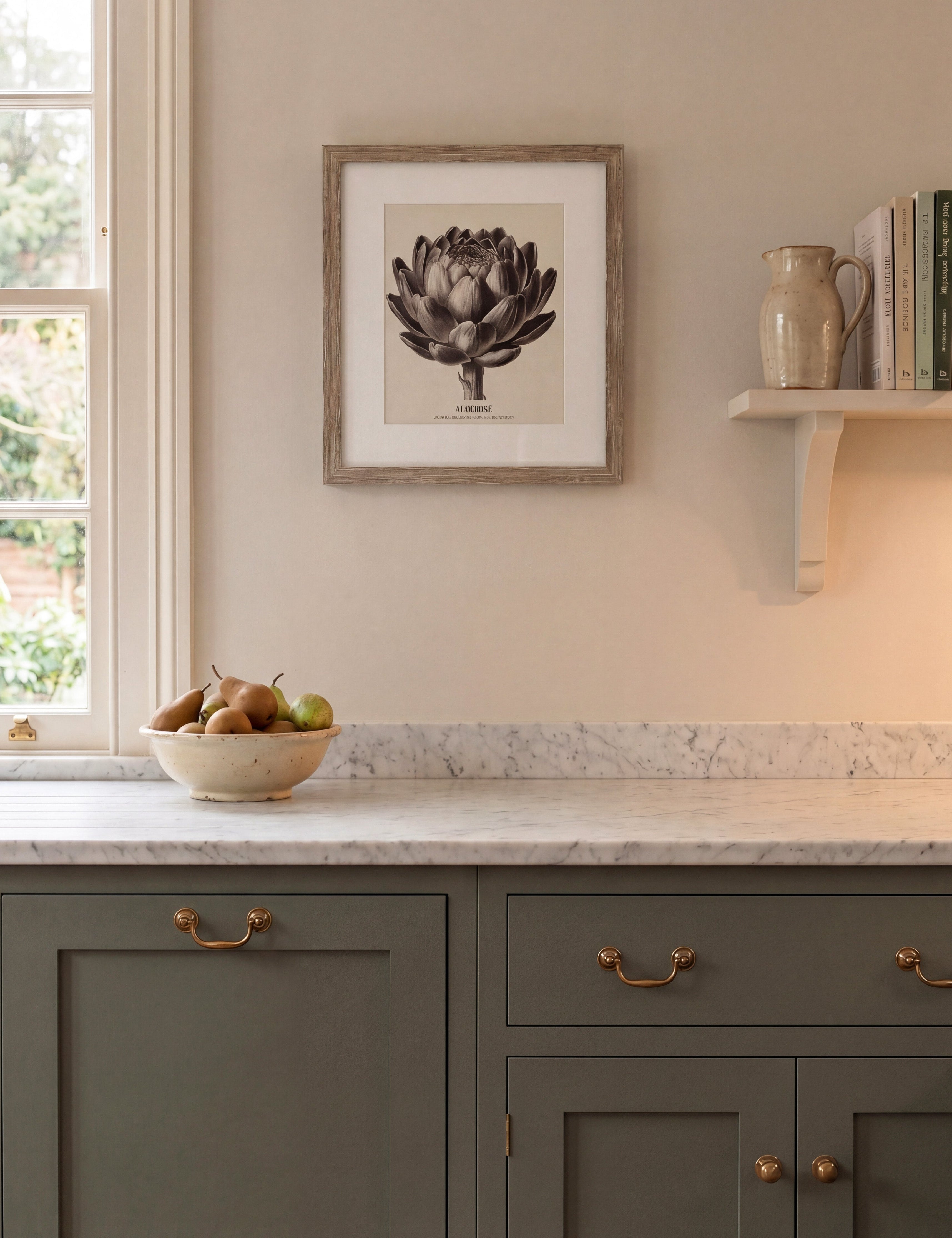 Kitchen interior with gray cabinets, marble countertop, and framed artwork on the wall.