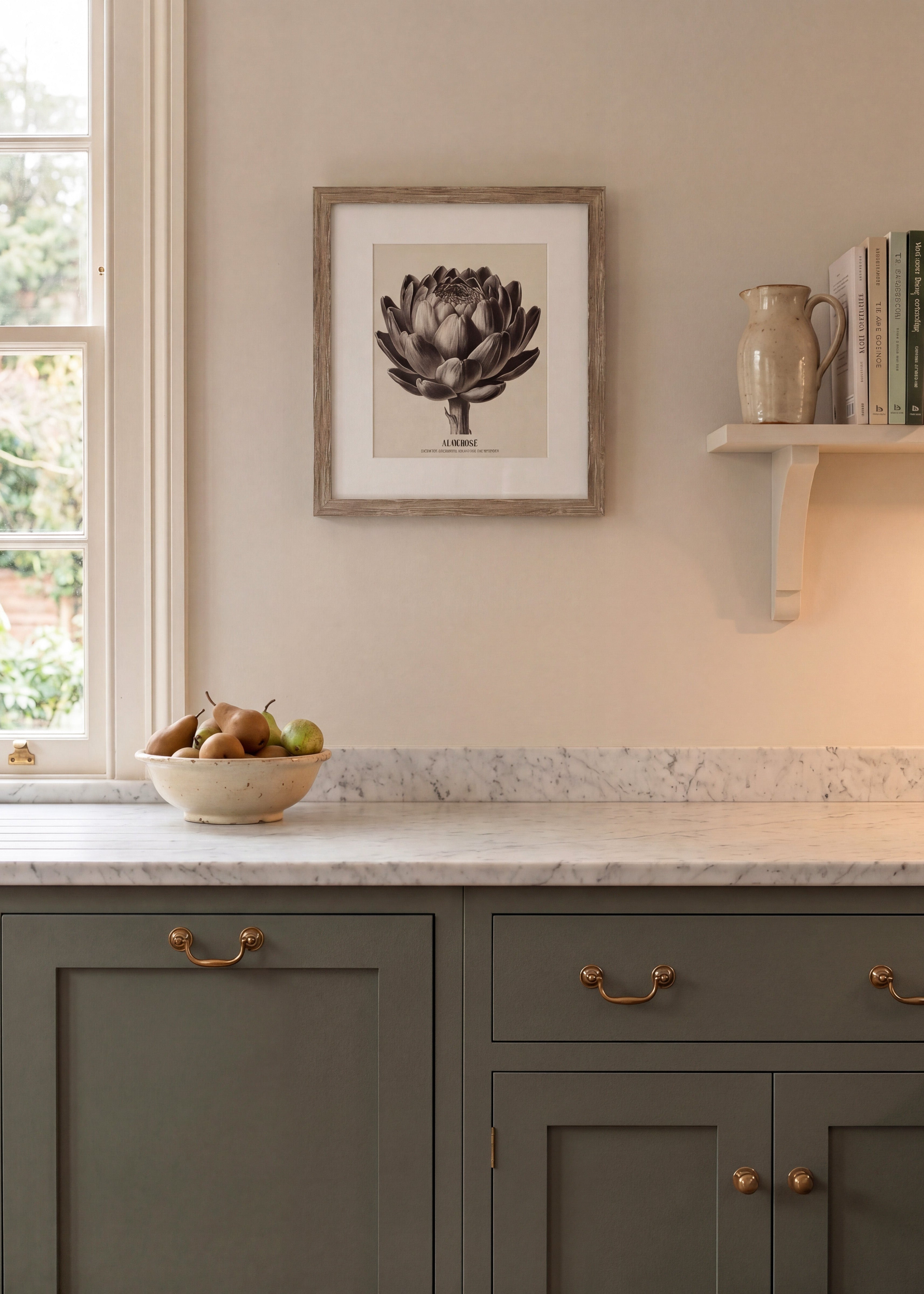 Kitchen interior with gray cabinets, marble countertop, and framed artwork on the wall.