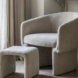Cream retro chair with footstool.  Curved back. 