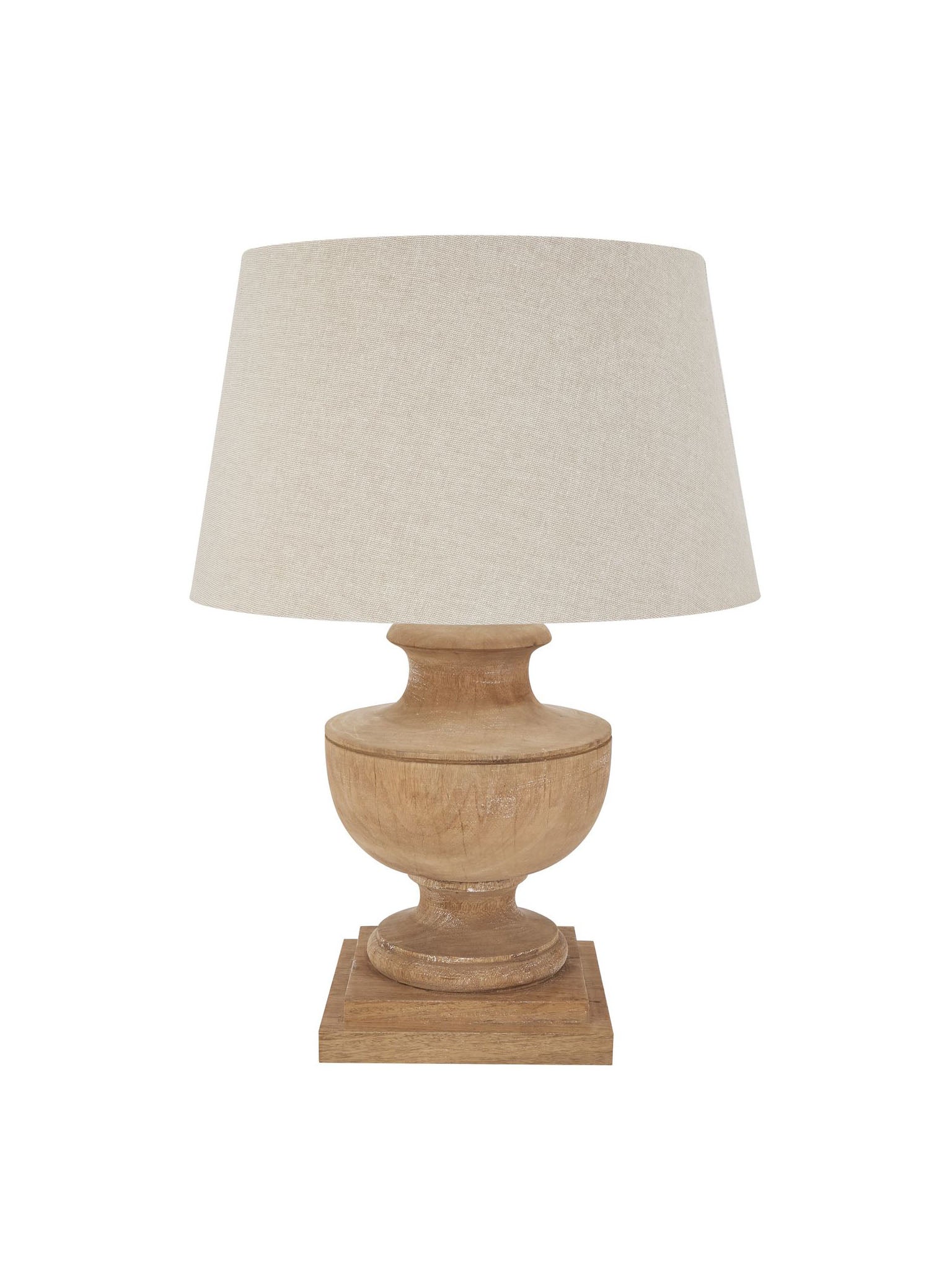 wooden turned lamp with pale linen shade