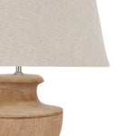 wooden turned lamp with pale linen shade