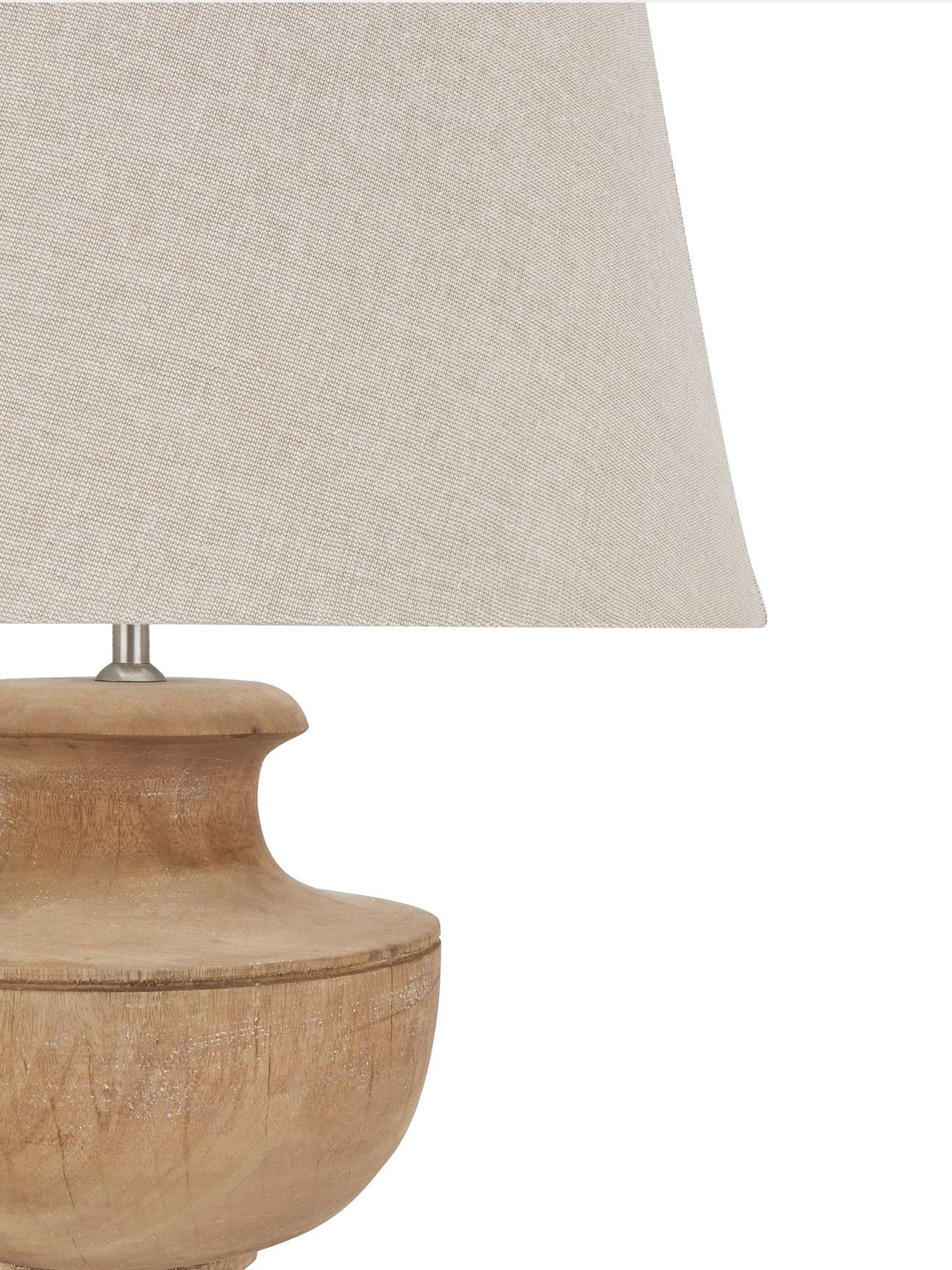 wooden turned lamp with pale linen shade