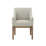 Light beige upholstered chair with wooden legs on a white background