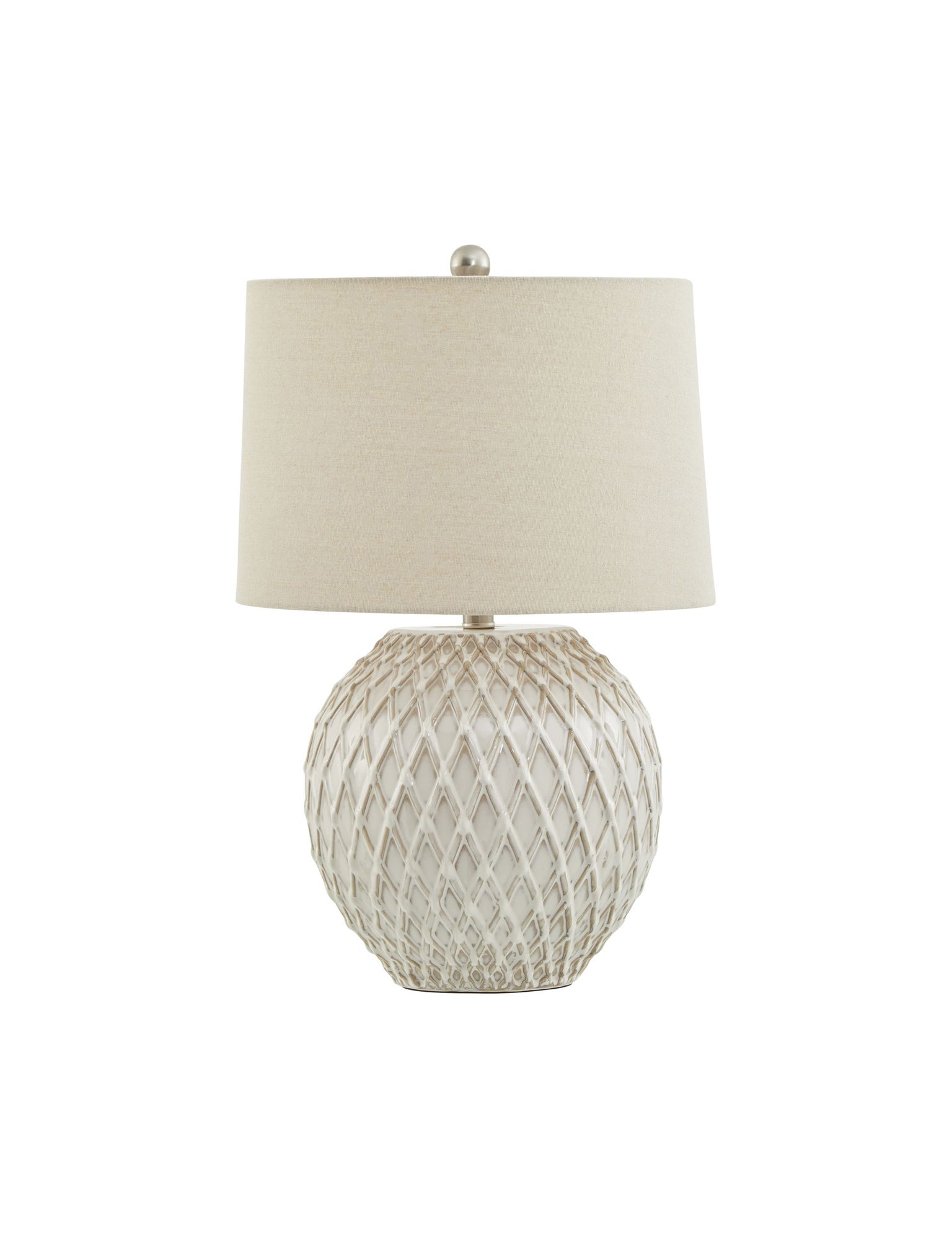 Table lamp with textured base and beige shade on a white background