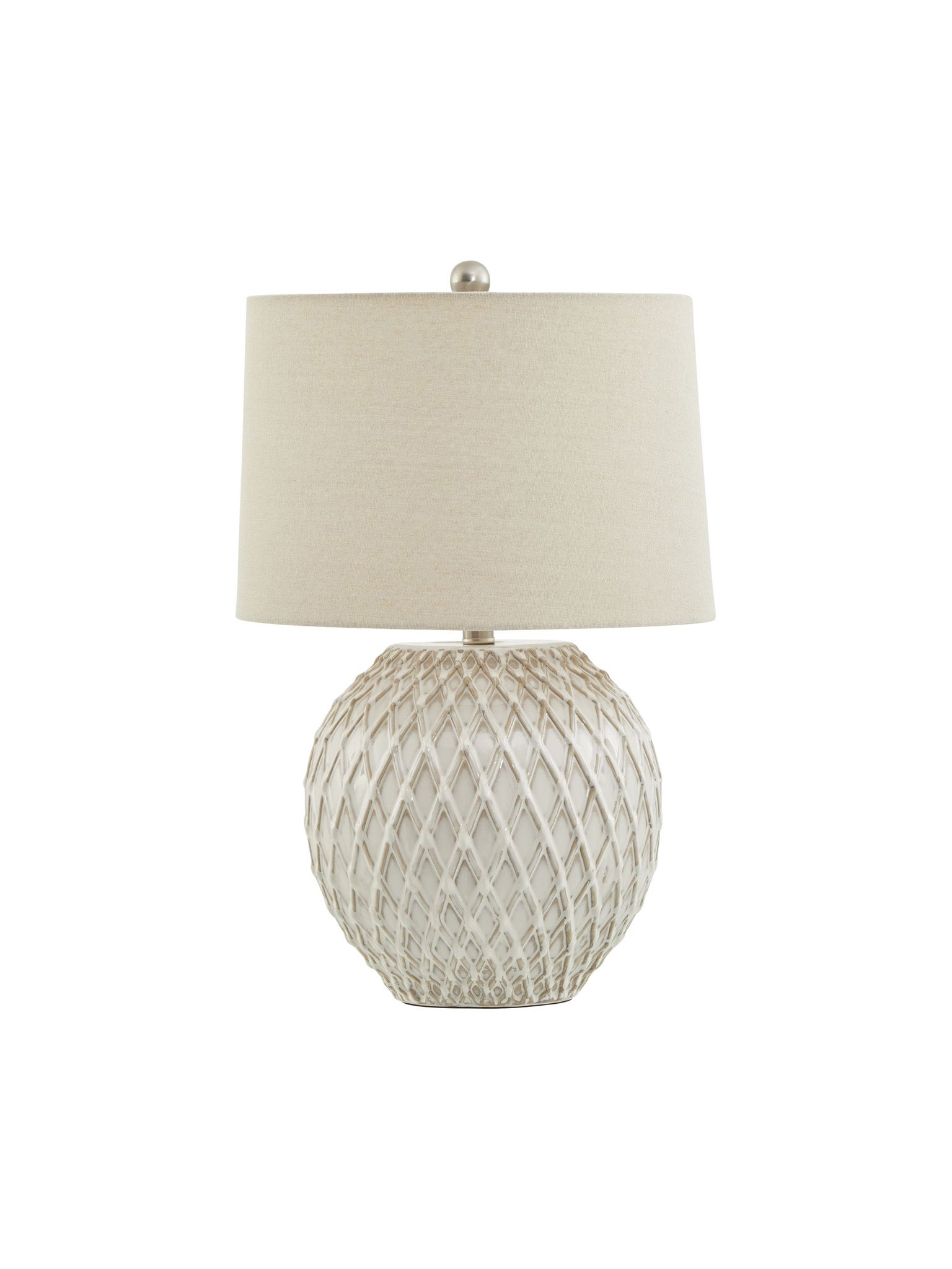 Table lamp with textured base and beige shade on a white background