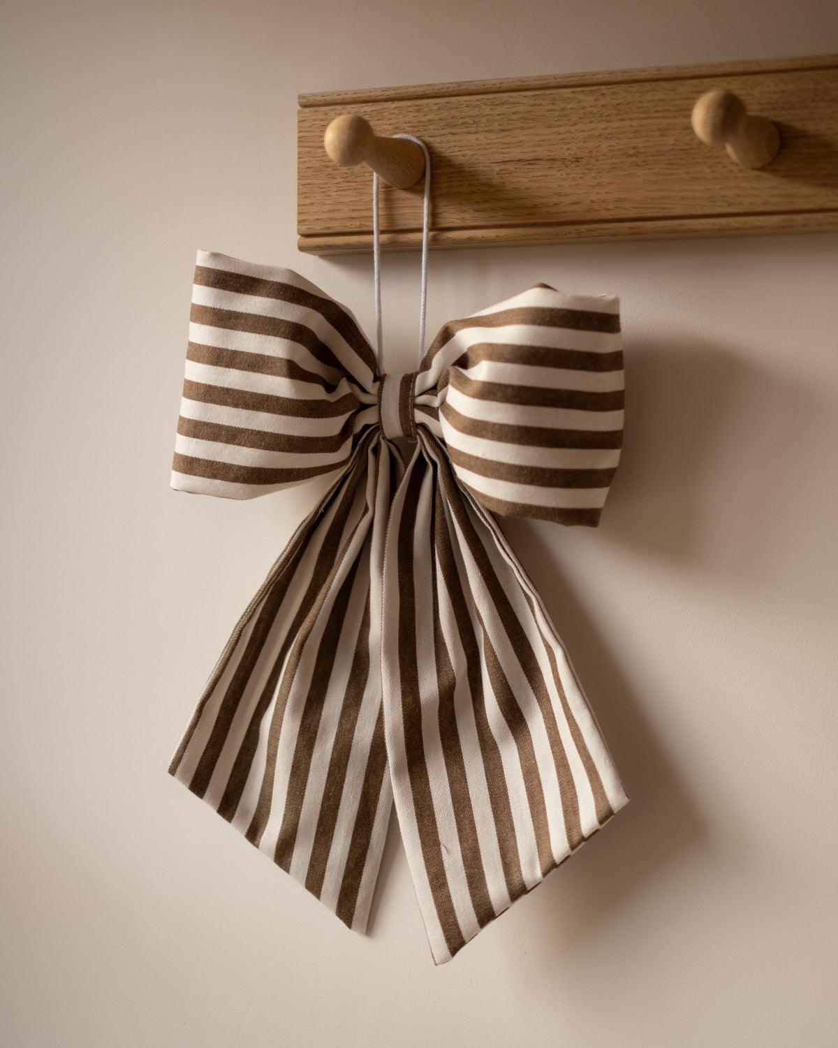 brown and white striped bow
