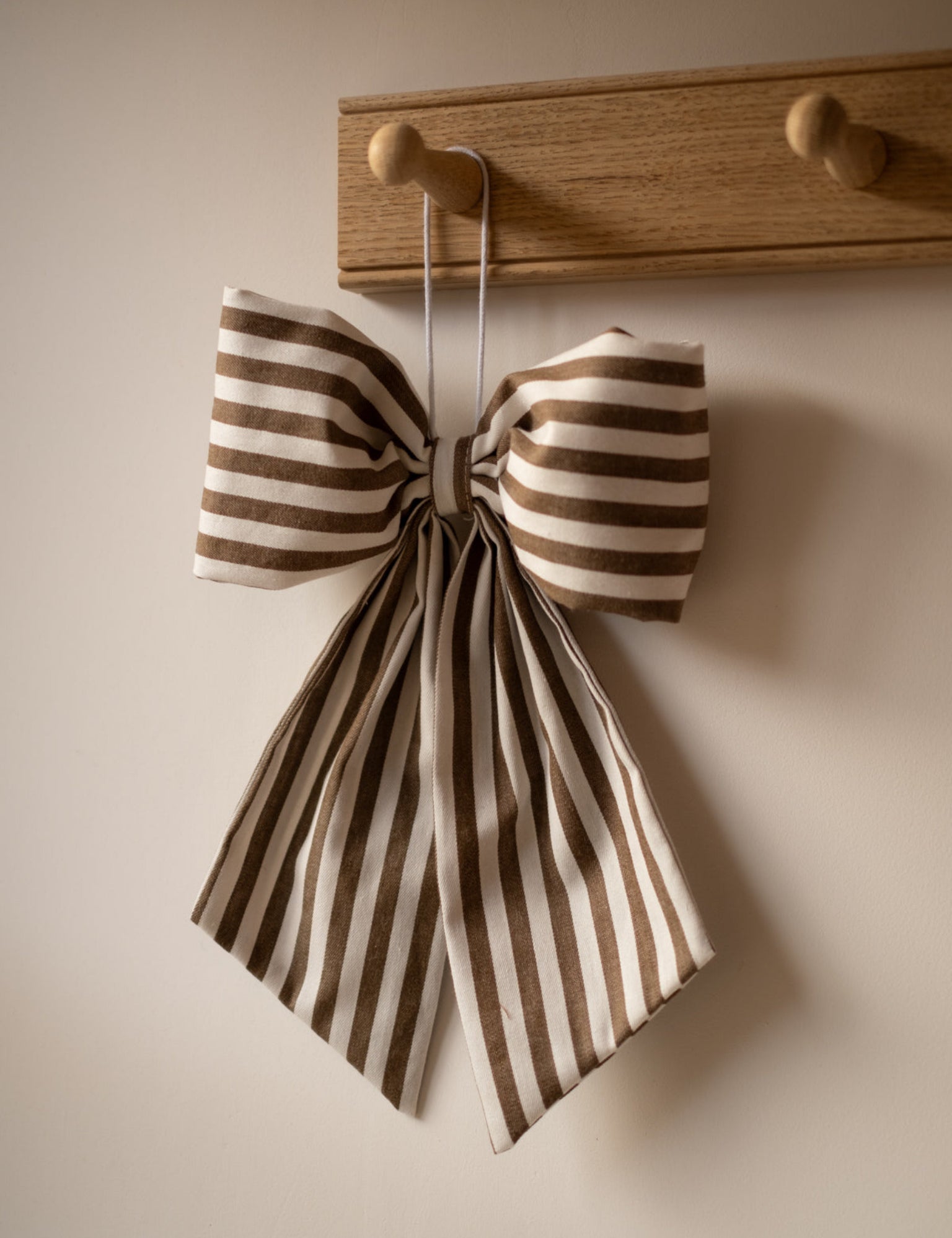 brown and white striped bow