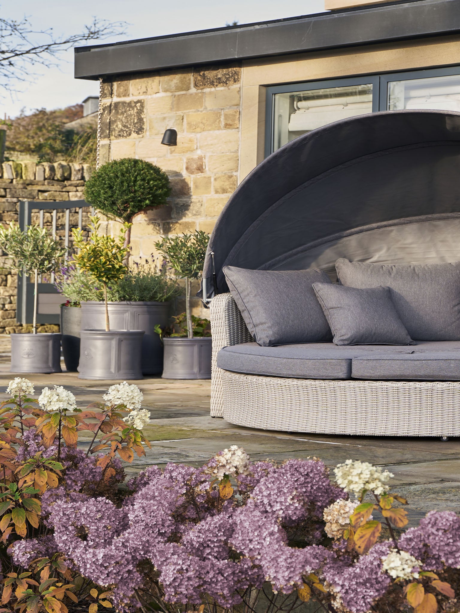 The St Lucia Day Bed is made from synthetic half round weave