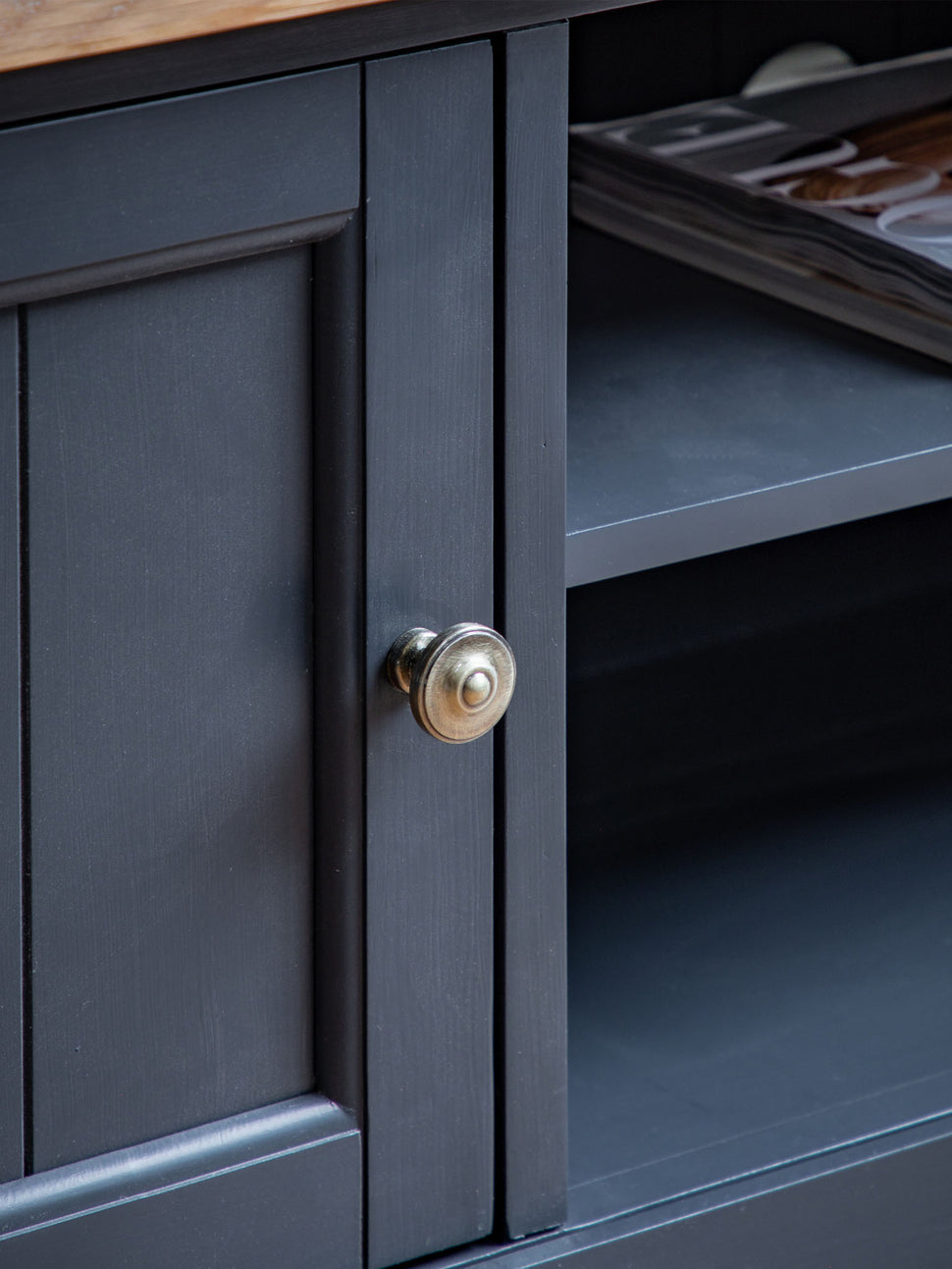 farmhouse style oak top media unit painted in dark navy