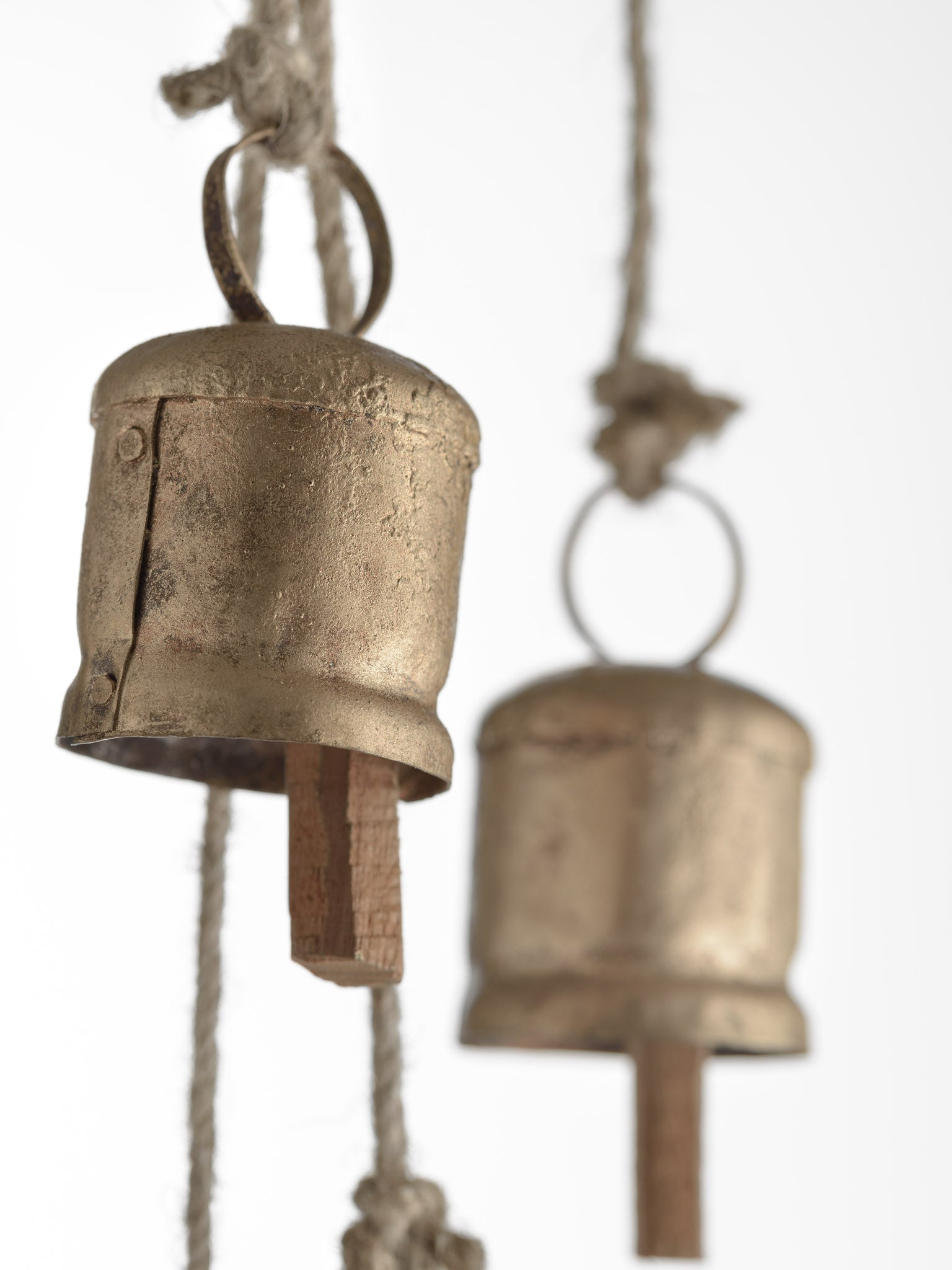 gold cow bells on a rope