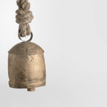 gold cow bell with rope