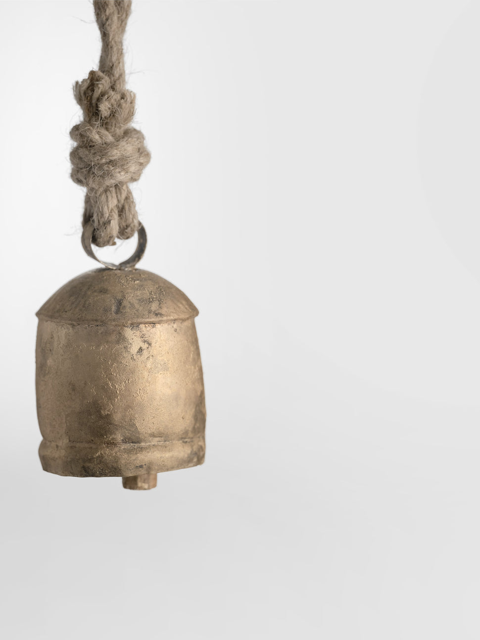 gold cow bell with rope